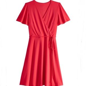 Ashley Graham beyond fake short sleeve wrap dress